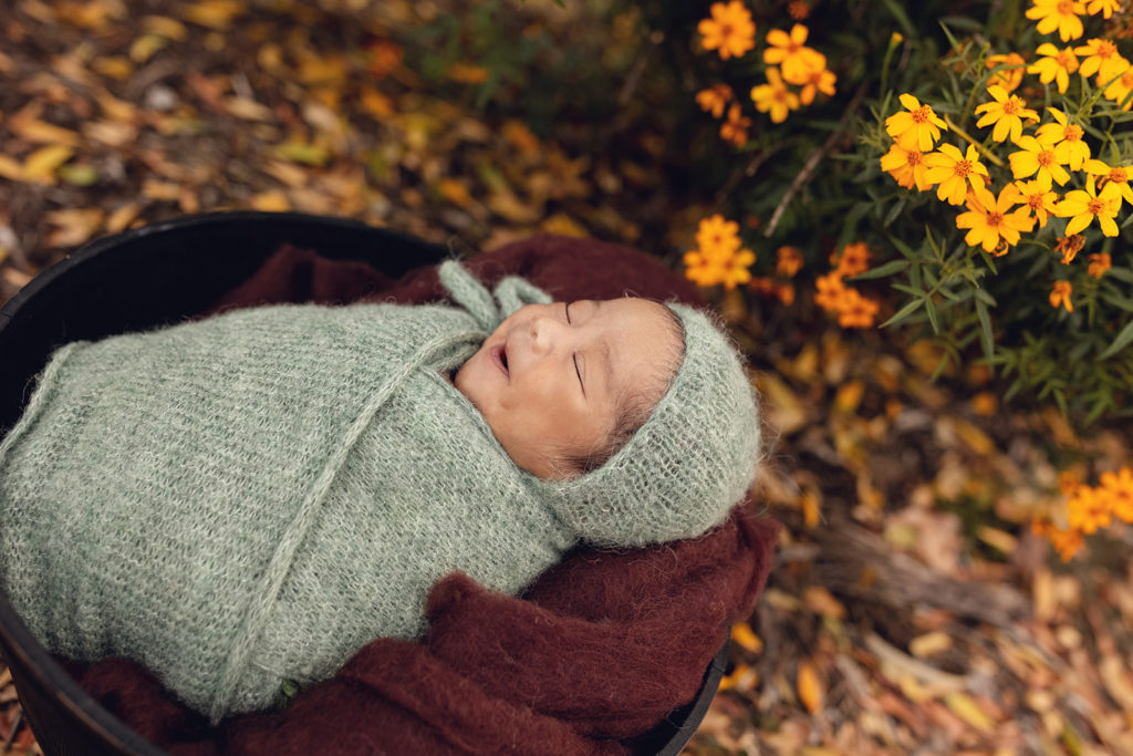 Little Cebi smiling in his sleep at his Newborn Photography Session in Perth, Western Australia